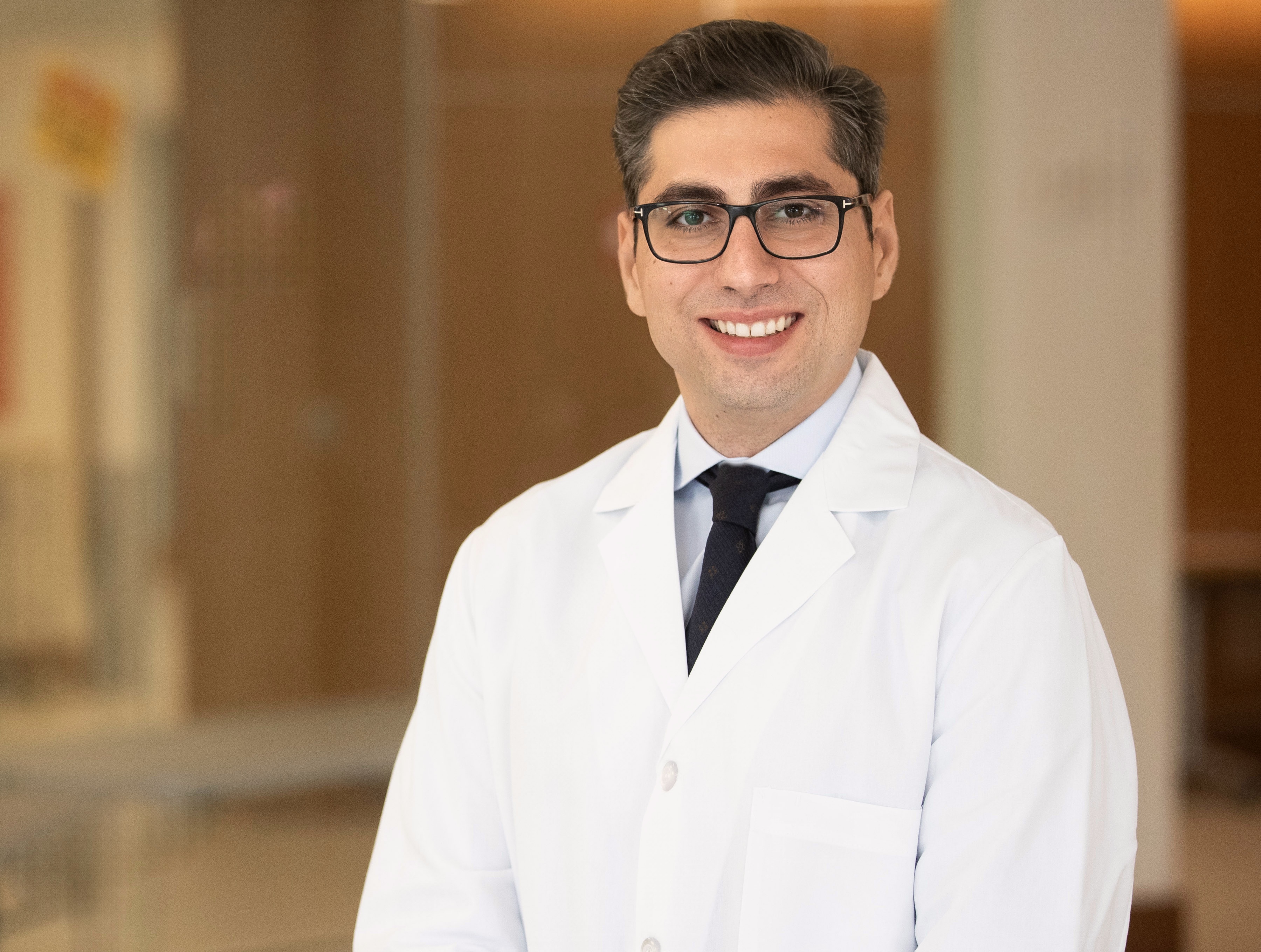 Dr. Vahram Ornekian in white coat